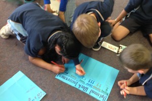 Year 2 students recording their names onto the Learning Likes and Preference Chart.